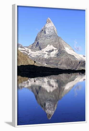 Hiker Admiring the Matterhorn Reflected in Lake Stellisee, Swiss Alps-Roberto Moiola-Framed Photographic Print