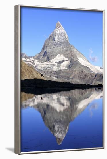 Hiker Admiring the Matterhorn Reflected in Lake Stellisee, Swiss Alps-Roberto Moiola-Framed Photographic Print