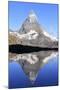 Hiker Admiring the Matterhorn Reflected in Lake Stellisee, Swiss Alps-Roberto Moiola-Mounted Photographic Print