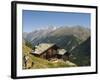 Hiker and Dog on Trail in Front of Traditional Slate Roofed House, Valais, Switzerland-Christian Kober-Framed Photographic Print