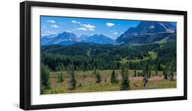 Hiker at wildflowers meadow, Monarch Ramparts, Healy Pass, Alberta, Canada-null-Framed Photographic Print