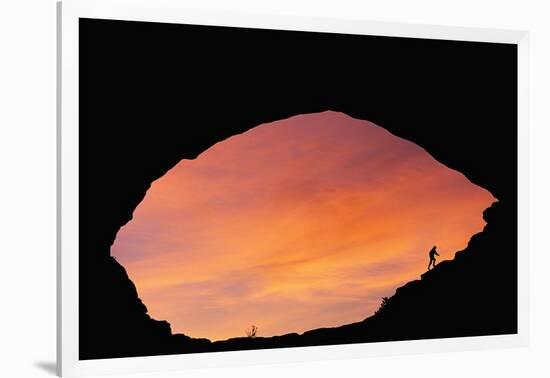 Hiker Climbing a Natural Arch in Utah-null-Framed Photographic Print