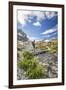 Hiker crossing a stream Engadine Canton of Grisons Switzerland Europe-ClickAlps-Framed Photographic Print