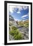 Hiker crossing a stream Engadine Canton of Grisons Switzerland Europe-ClickAlps-Framed Photographic Print