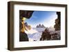Hiker on rocks admiring Tre Cime di Lavaredo and Monte Paterno covered with snow-Roberto Moiola-Framed Photographic Print