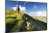 Hiker on steep ridge on the ascent towards Monte Azzarini, San Marco Pass, Albaredo Valley-Roberto Moiola-Mounted Photographic Print