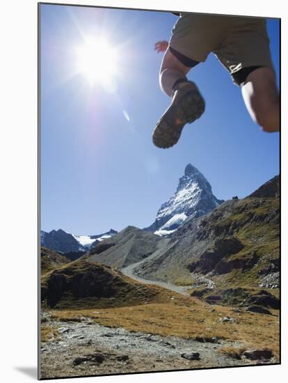 Hiker Running on Trail and the Matterhorn, 4477M, Zermatt Alpine Resort, Swiss Alps, Switzerland-Christian Kober-Mounted Photographic Print