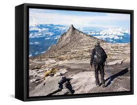 Hiker Walking at the Top of Mount Kinabalu in Sabah, Malaysia-R.M. Nunes-Framed Stretched Canvas