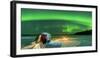 Hiker watching the Aurora Borealis (Northern Lights) close to bonfire and igloo-Roberto Moiola-Framed Photographic Print