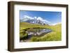 Hiker with dog admires the peaks of Mont De La Saxe reflected in water, Courmayeur, Aosta Valley, I-Roberto Moiola-Framed Photographic Print