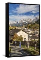 Hikers admire Ardez village surrounded by woods and snowy peaks Lower Engadine Canton of Switzerlan-ClickAlps-Framed Stretched Canvas