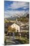 Hikers admire Ardez village surrounded by woods and snowy peaks Lower Engadine Canton of Switzerlan-ClickAlps-Mounted Premium Photographic Print