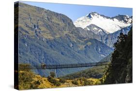 Hikers Cross a Footbridge, Rob Roy Glacier Trail, New Zealand-James White-Stretched Canvas