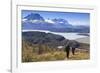 Hikers Descend a Grassy Slope with Lake-Eleanor Scriven-Framed Photographic Print