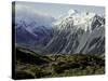 Hikers Look up at Snowy Mountain Top, New Zealand-Michael Brown-Stretched Canvas