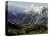 Hikers Look up at Snowy Mountain Top, New Zealand-Michael Brown-Stretched Canvas