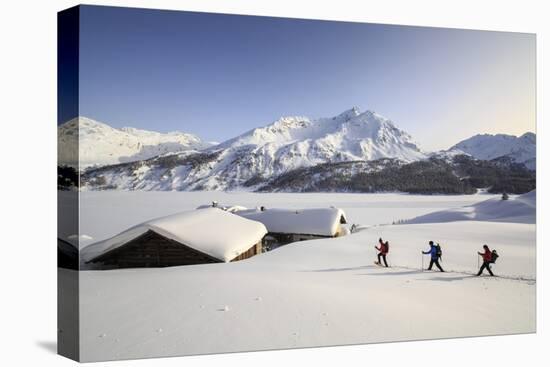 Hikers on Snowshoes, Spluga, Maloja Pass. Engadine. Switzerland. Europe-ClickAlps-Stretched Canvas