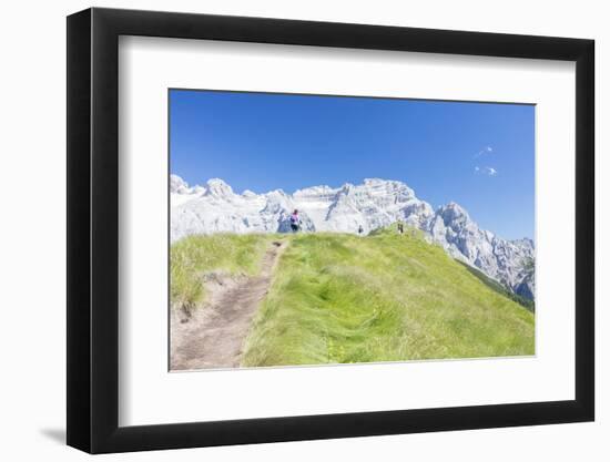 Hikers proceed on the path to the rocky peaks, Doss Del Sabion, Pinzolo, Brenta Dolomites, Trentino-Roberto Moiola-Framed Premium Photographic Print