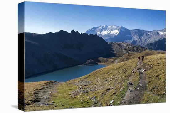 Hikers Walking on the Colle Del Nivolet Beside Rossett Lake (Lago Rossett)-Roberto Moiola-Stretched Canvas