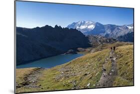 Hikers Walking on the Colle Del Nivolet Beside Rossett Lake (Lago Rossett)-Roberto Moiola-Mounted Photographic Print