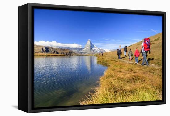 Hikers Walking on the Path Beside the Stellisee with the Matterhorn Reflected-Roberto Moiola-Framed Stretched Canvas