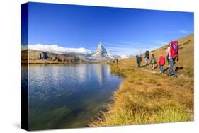 Hikers Walking on the Path Beside the Stellisee with the Matterhorn Reflected-Roberto Moiola-Stretched Canvas