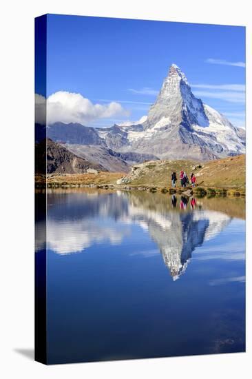 Hikers Walking on the Path Beside the Stellisee with the Matterhorn Reflected-Roberto Moiola-Stretched Canvas