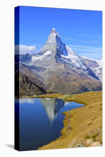 Hikers Walking on the Path Beside the Stellisee with the Matterhorn Reflected-Roberto Moiola-Stretched Canvas