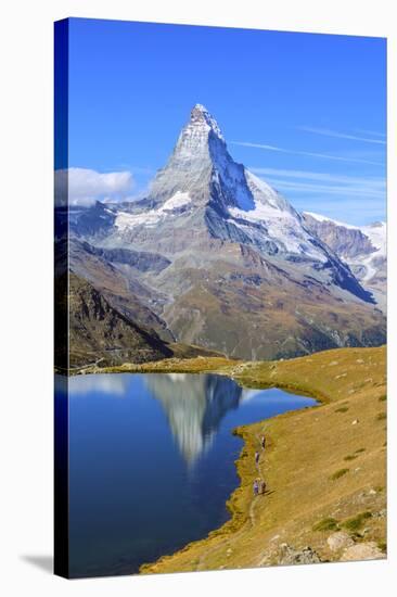 Hikers Walking on the Path Beside the Stellisee with the Matterhorn Reflected-Roberto Moiola-Stretched Canvas