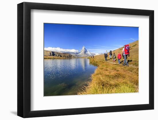 Hikers Walking on the Path Beside the Stellisee with the Matterhorn Reflected-Roberto Moiola-Framed Premium Photographic Print