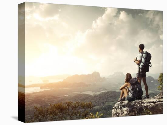 Hikers With Backpacks Enjoying Valley View From Top Of A Mountain-Dudarev Mikhail-Stretched Canvas