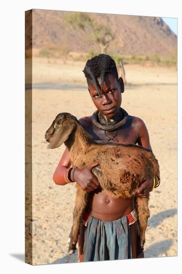 Himba Girl With Traditional Double Plait Hairstyle, Carrying A Goat-Eric Baccega-Stretched Canvas