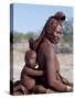 Himba Mother and Child Ride Home on Donkey, Bodies Gleaming from a Red Ochre Mixture, Namibia-Nigel Pavitt-Stretched Canvas