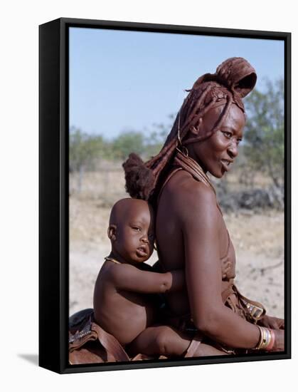 Himba Mother and Child Ride Home on Donkey, Bodies Gleaming from a Red Ochre Mixture, Namibia-Nigel Pavitt-Framed Stretched Canvas