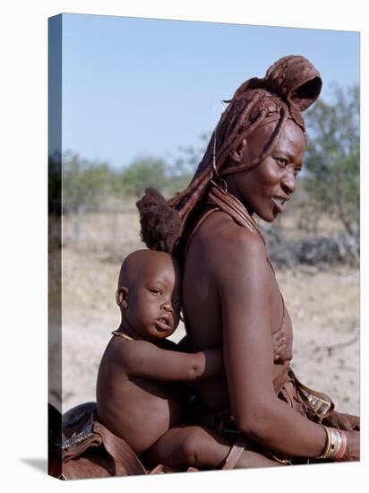 Himba Mother and Child Ride Home on Donkey, Bodies Gleaming from a Red Ochre Mixture, Namibia-Nigel Pavitt-Stretched Canvas