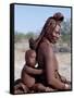 Himba Mother and Child Ride Home on Donkey, Bodies Gleaming from a Red Ochre Mixture, Namibia-Nigel Pavitt-Framed Stretched Canvas