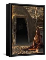 Himba Woman Grinding Rock into Powder, Purros Village, Kaokoland, Namibia-Kim Walker-Framed Stretched Canvas