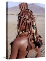 Himba Woman in Traditional Attire, Her Body Gleams from a Red Ochre Mixture of Red Ochre, Namibia-Nigel Pavitt-Stretched Canvas