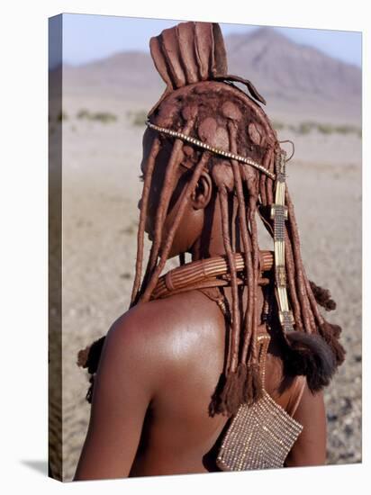 Himba Woman in Traditional Attire, Her Body Gleams from a Red Ochre Mixture of Red Ochre, Namibia-Nigel Pavitt-Stretched Canvas