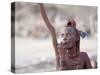 Himba Woman Smokes Outside Her Thatched Home in the Tiny Village, Purros, Namibia, Africa-Kim Walker-Stretched Canvas