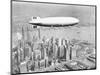 Hindenburg Flying over Lower Manhattan-null-Mounted Photographic Print