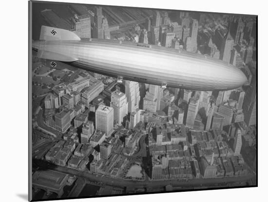 Hindenburg Flying over Manhattan-null-Mounted Photographic Print