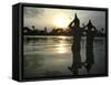 Hindu Devotees Offer Prayers to the Sun God at Sunset-null-Framed Stretched Canvas