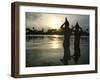 Hindu Devotees Offer Prayers to the Sun God at Sunset-null-Framed Premium Photographic Print