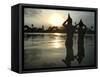 Hindu Devotees Offer Prayers to the Sun God at Sunset-null-Framed Stretched Canvas