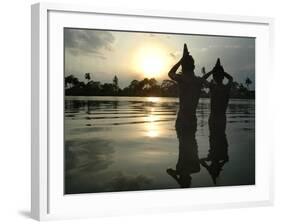 Hindu Devotees Offer Prayers to the Sun God at Sunset-null-Framed Photographic Print