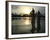 Hindu Devotees Offer Prayers to the Sun God at Sunset-null-Framed Photographic Print