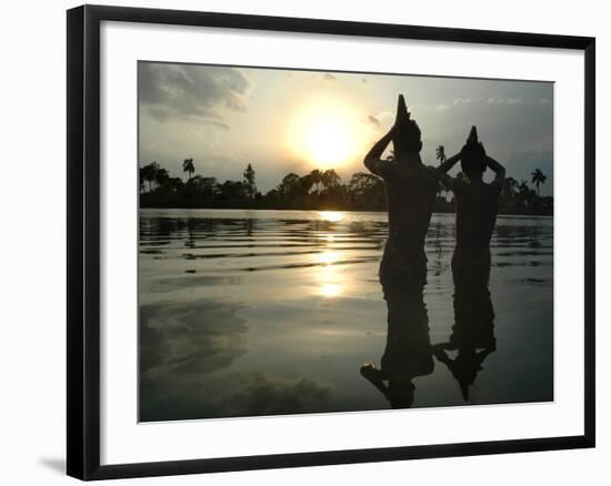 Hindu Devotees Offer Prayers to the Sun God at Sunset-null-Framed Photographic Print