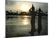 Hindu Devotees Offer Prayers to the Sun God at Sunset-null-Mounted Photographic Print