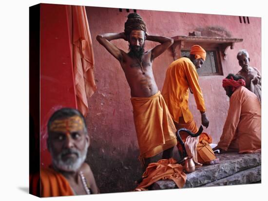 Hindu Holy Men Relax after Taking Holy Dip in River Ganges During the Kumbh Mela Festival in India-null-Stretched Canvas